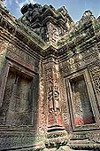 Ta Prohm temple - devatas sculpted on the gallery walls 